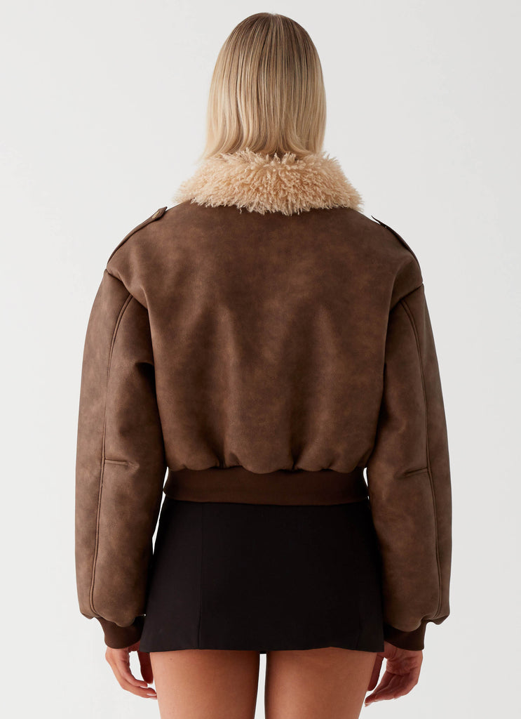 Womens Aston Shearling Bomber Jacket in the colour Brown in front of a light grey background