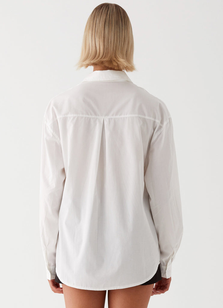 Womens Laurel Long Sleeve Oversized Shirt in the colour White in front of a light grey background