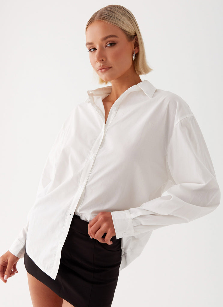 Womens Laurel Long Sleeve Oversized Shirt in the colour White in front of a light grey background