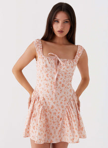 Womens Luna Ditsy Mini Dress in the colour Pink Ditsy Floral in front of a light grey background
