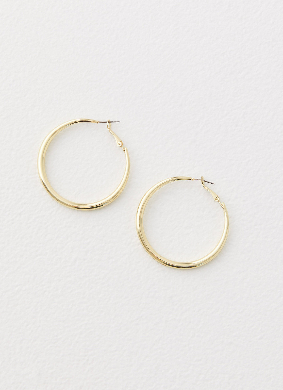 Womens Mutual Feelings Earrings in the colour Gold in front of a light grey background