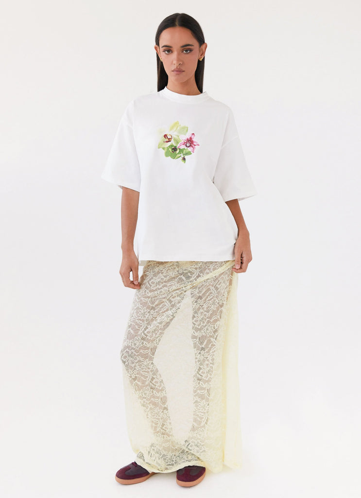 Womens Lillies Oversized Tee in the colour White in front of a light grey background