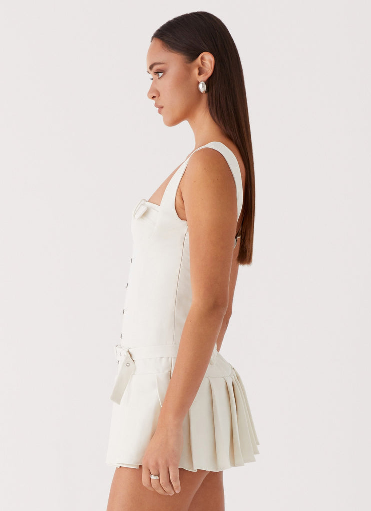 Womens Poetic Justice Belt Mini Dress in the colour White in front of a light grey background