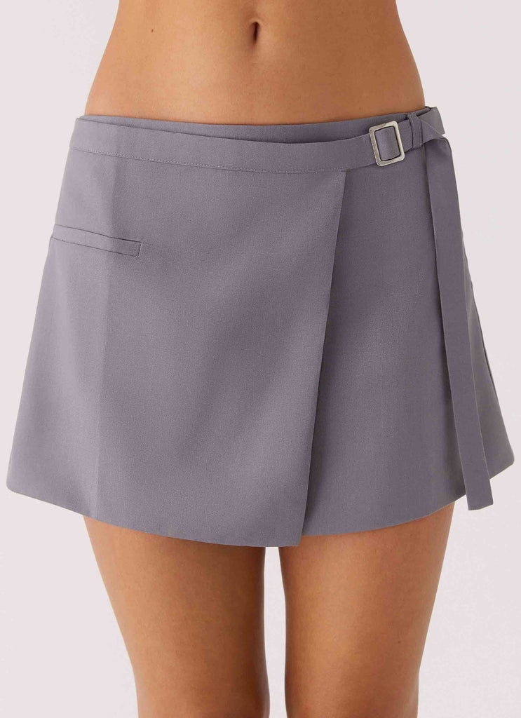 Womens Diane Belt Mini Skirt in the colour Charcoal in front of a light grey background