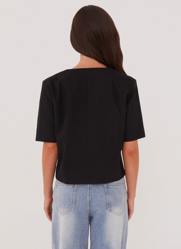 Womens Hacienda Linen Short Sleeve Blazer in the colour Black in front of a light grey background