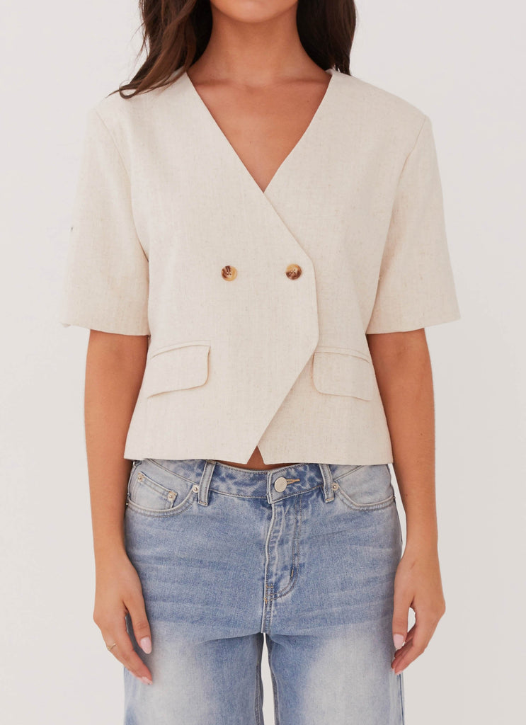 Womens Hacienda Linen Short Sleeve Blazer in the colour Oatmeal in front of a light grey background