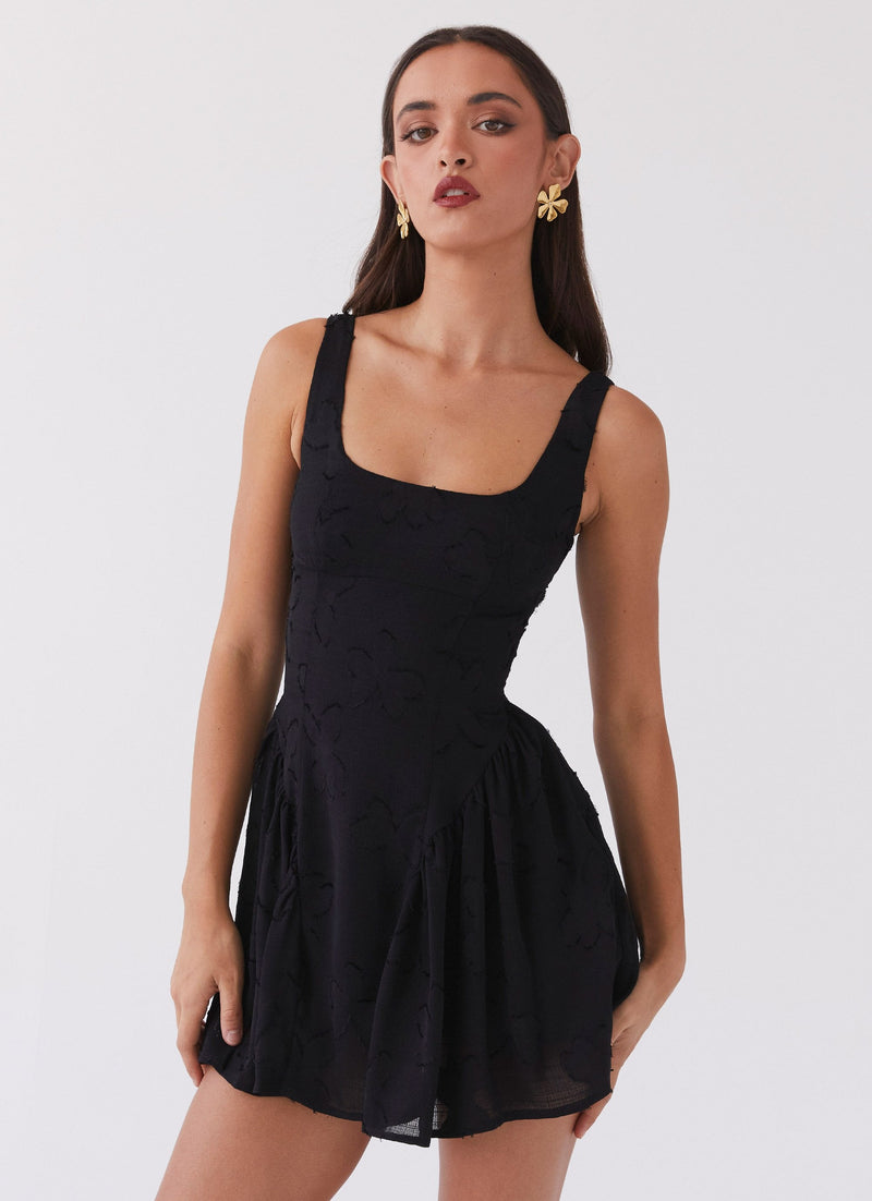 Womens Evelyn Mini Dress in the colour Black in front of a light grey background