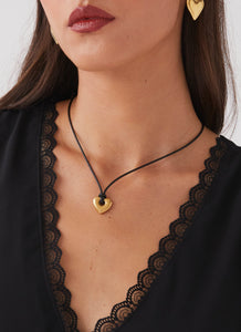 Womens Laney Heart Rope Necklace in the colour Gold in front of a light grey background