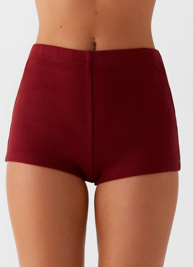 Womens Spectate Mini Shorts in the colour Maroon in front of a light grey background