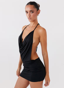 Womens Calista Halterneck Mini Dress in the colour Black in front of a light grey background