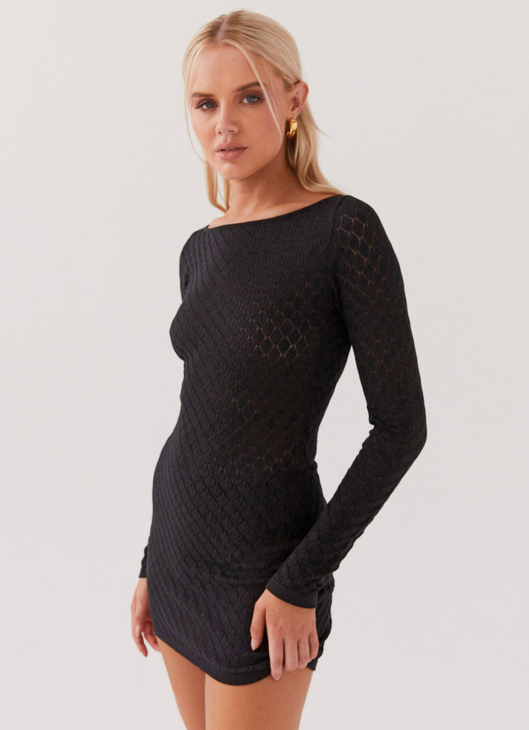 Womens Elia Knit Long Sleeve Mini Dress in the colour Black in front of a light grey background