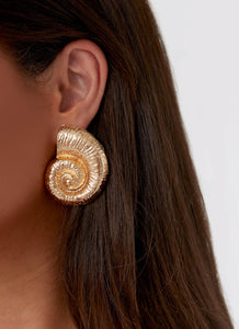 Womens Beachcomber Earrings in the colour Gold in front of a light grey background