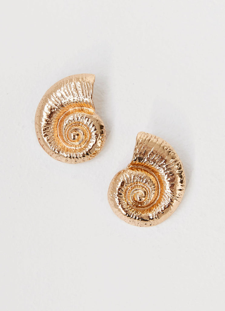 Womens Beachcomber Earrings in the colour Gold in front of a light grey background