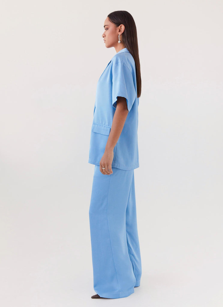 Womens Brinkley Oversized Satin Shirt in the colour Sky Blue in front of a light grey background