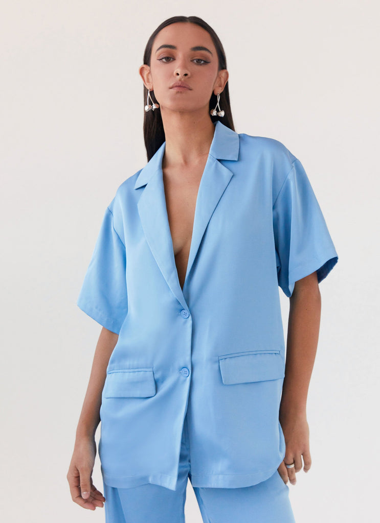 Womens Brinkley Oversized Satin Shirt in the colour Sky Blue in front of a light grey background