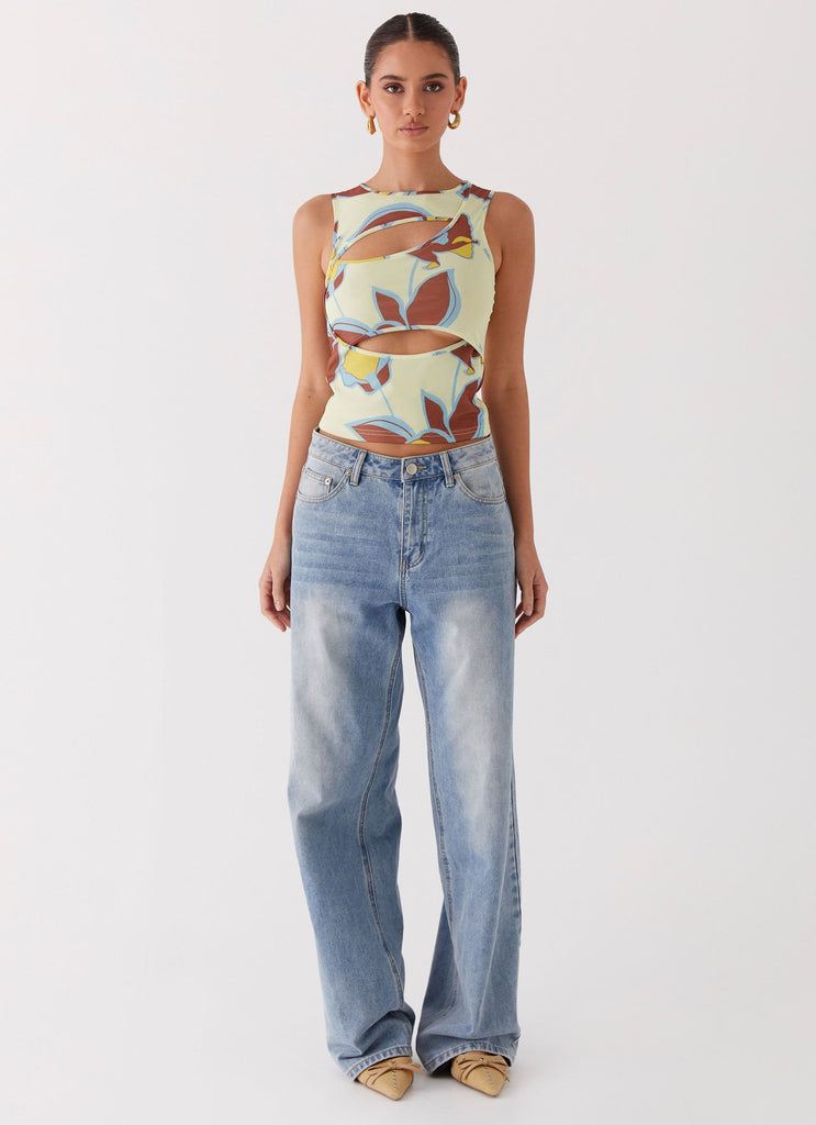 Womens Beyond Cut Out Mesh Top in the colour Primrose in front of a light grey background