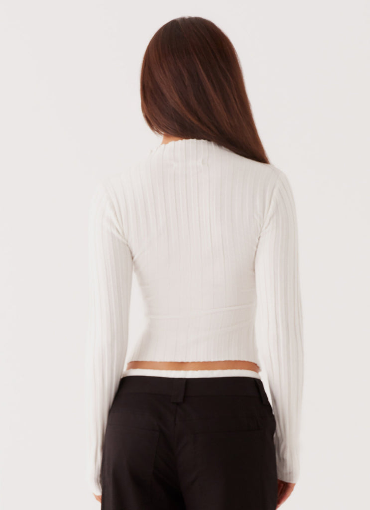 Womens Romera Long Sleeve Top in the colour White in front of a light grey background