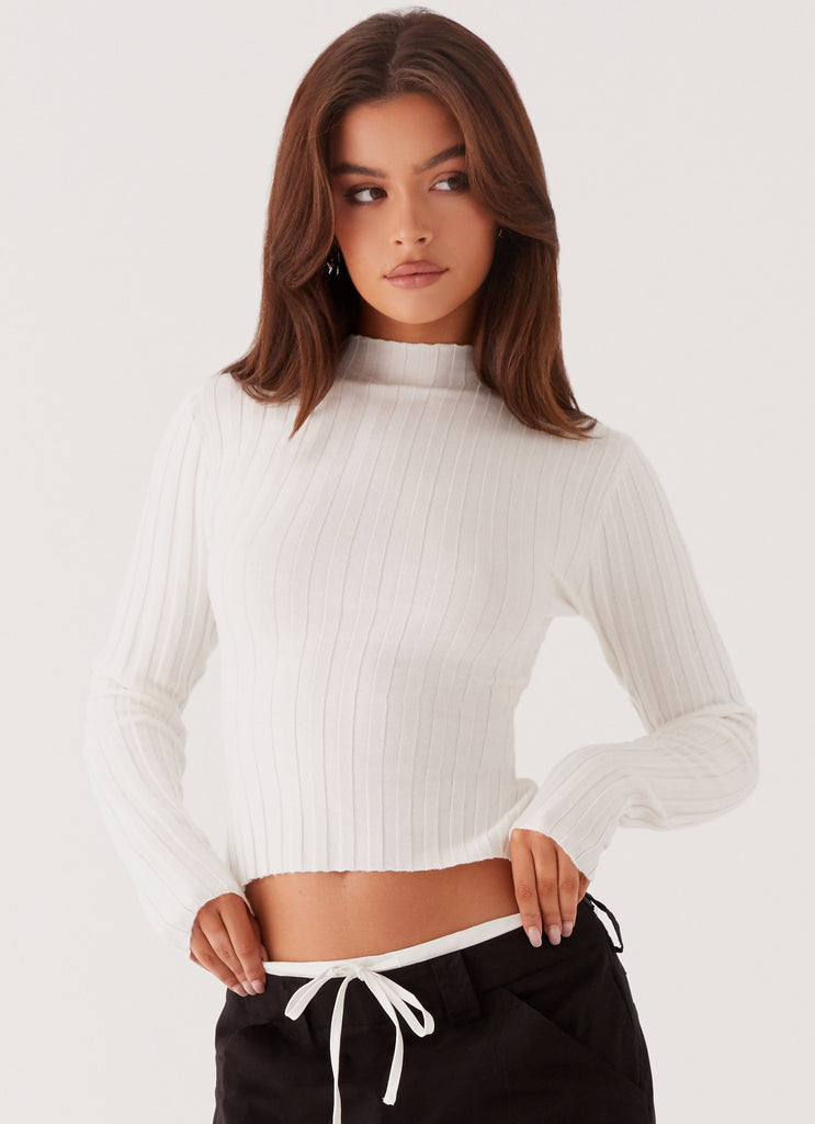 Womens Romera Long Sleeve Top in the colour White in front of a light grey background