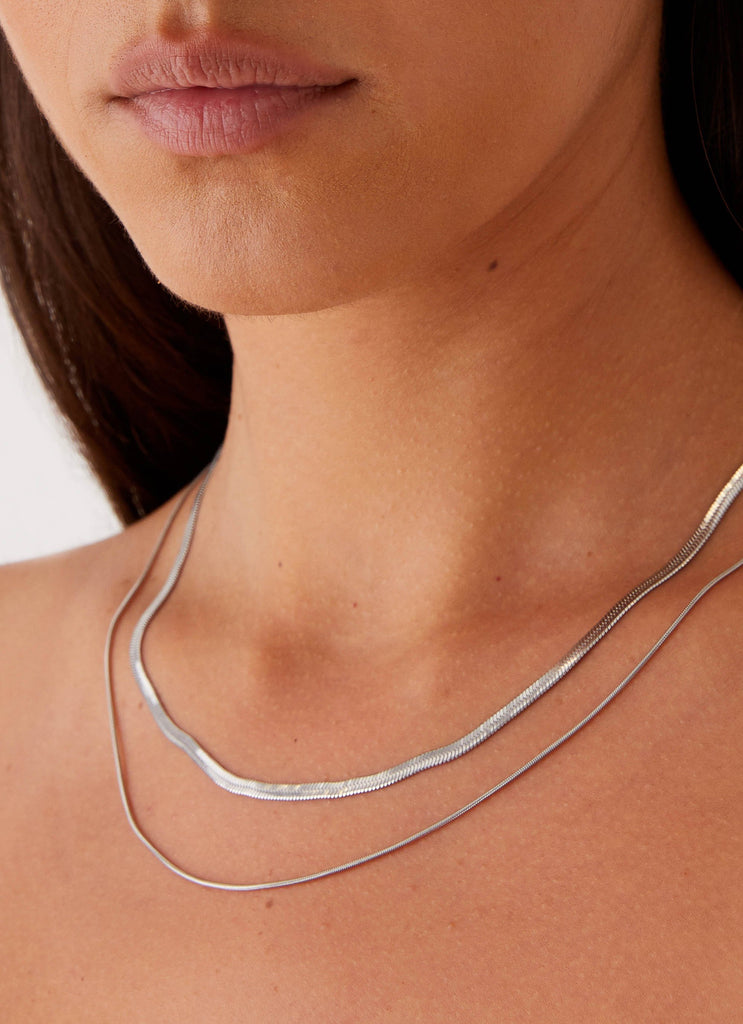 Womens Ria Necklace in the colour Silver in front of a light grey background