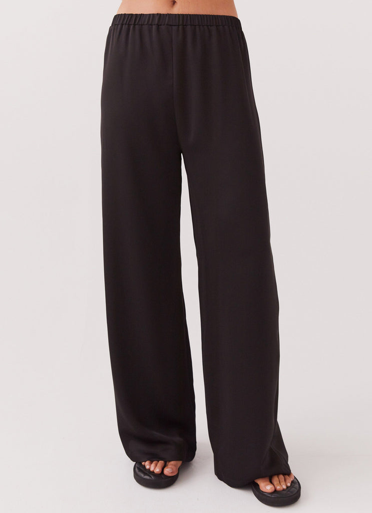 Womens Palm Cove Satin Pants in the colour Black in front of a light grey background