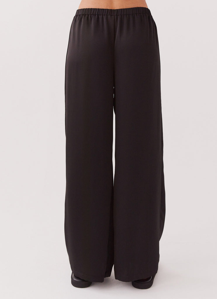 Womens Palm Cove Satin Pants in the colour Black in front of a light grey background