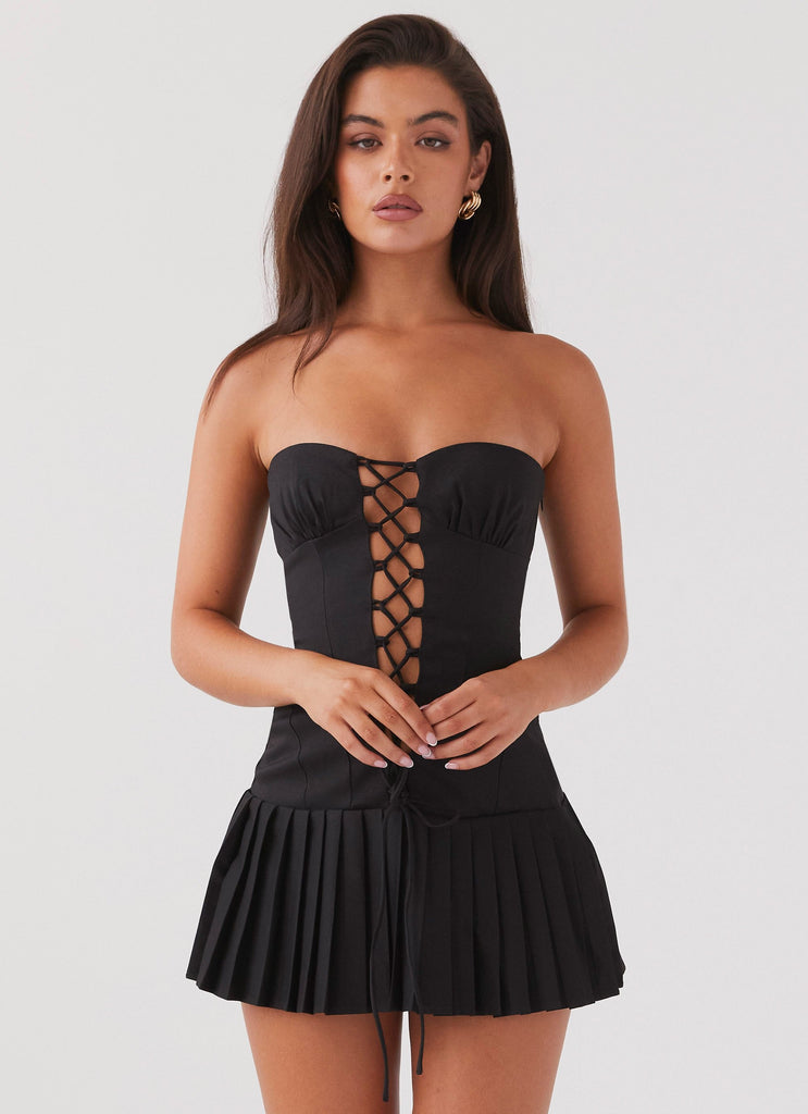 Womens Heating Up Lace Up Mini Dress in the colour Black in front of a light grey background