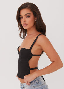 Womens Naomi Backless Top in the colour Black in front of a light grey background