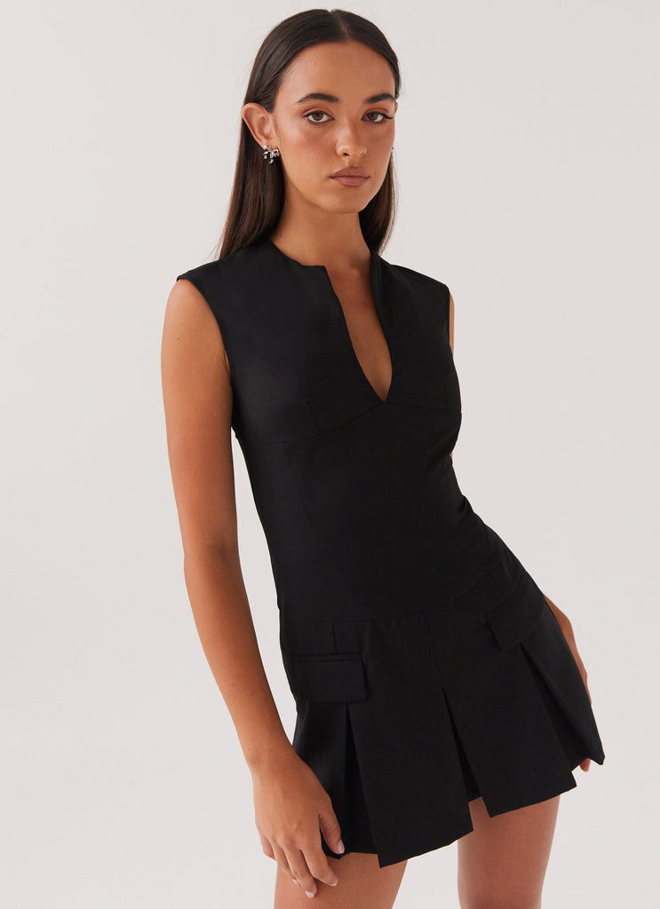 Womens Cassia Mini Dress in the colour Black in front of a light grey background