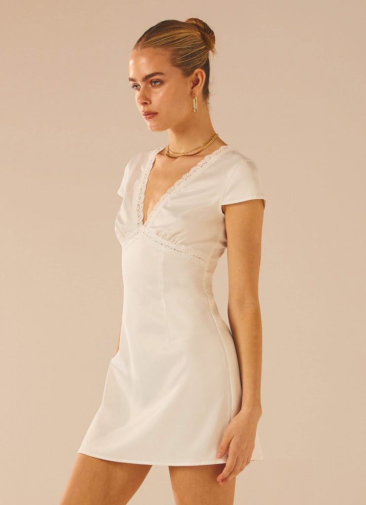 Womens French Oasis Mini Dress in the colour White Rose in front of a light grey background