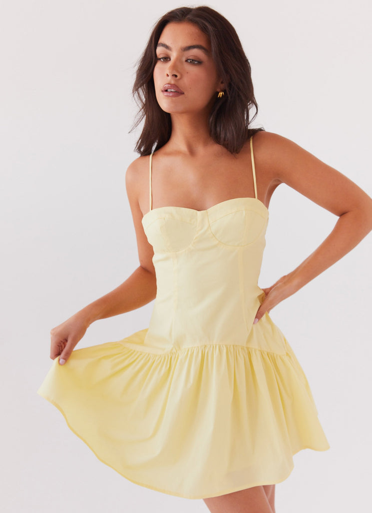 Womens Endless Summer Mini Dress in the colour Canary in front of a light grey background