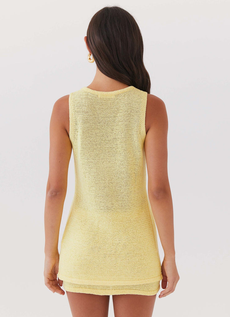 Womens Capri Glow Knit Top in the colour Canary in front of a light grey background