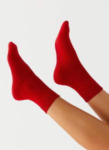 Womens Yelina Slouch Socks in the colour Red in front of a light grey background