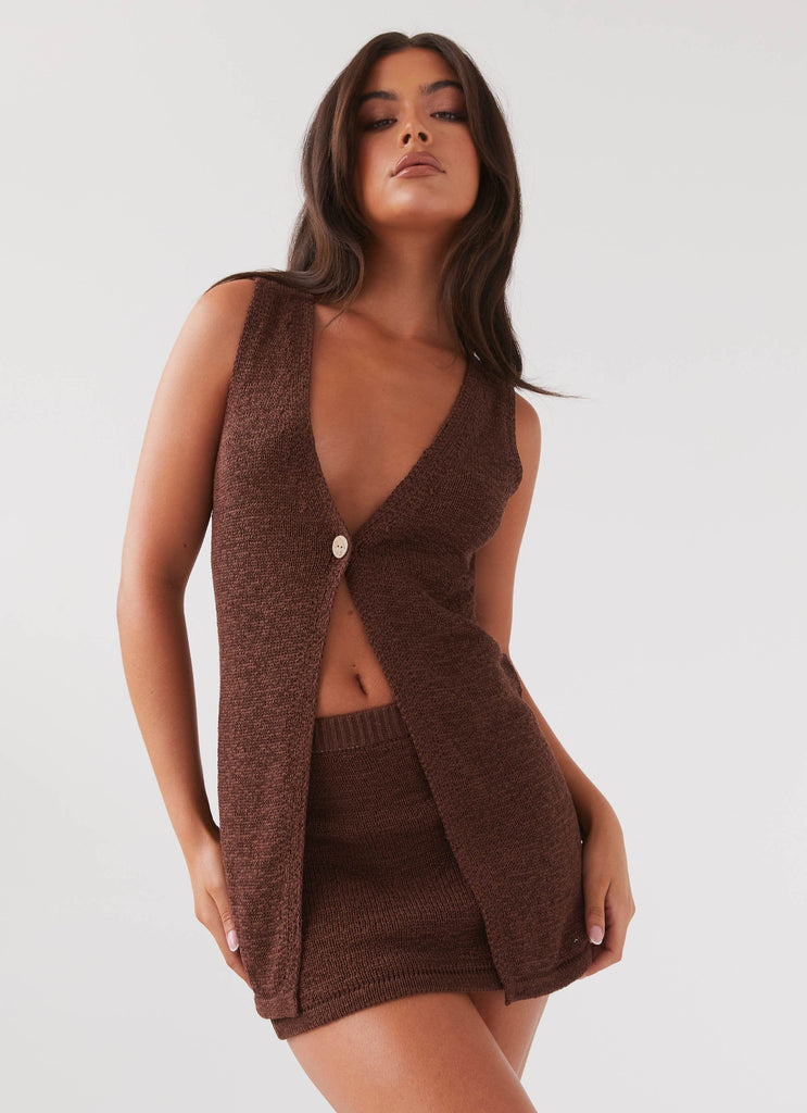 Womens Capri Glow Knit Top in the colour Chocolate in front of a light grey background