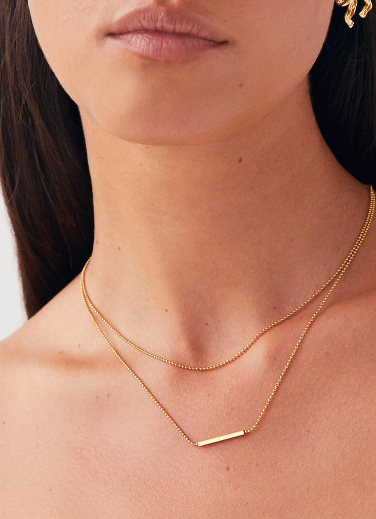 Womens Levant Chain Necklace in the colour Gold in front of a light grey background