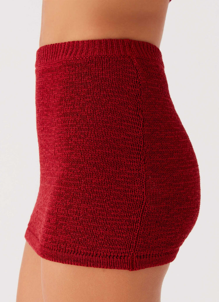 Womens Capri Glow Knit Skirt in the colour Maroon in front of a light grey background