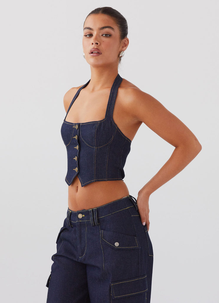 Womens Avari Halterneck Denim Vest in the colour Indigo in front of a light grey background