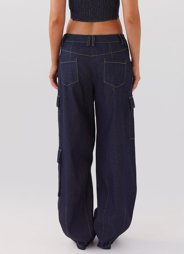 Womens Greedy Denim Cargo Pants in the colour Indigo in front of a light grey background