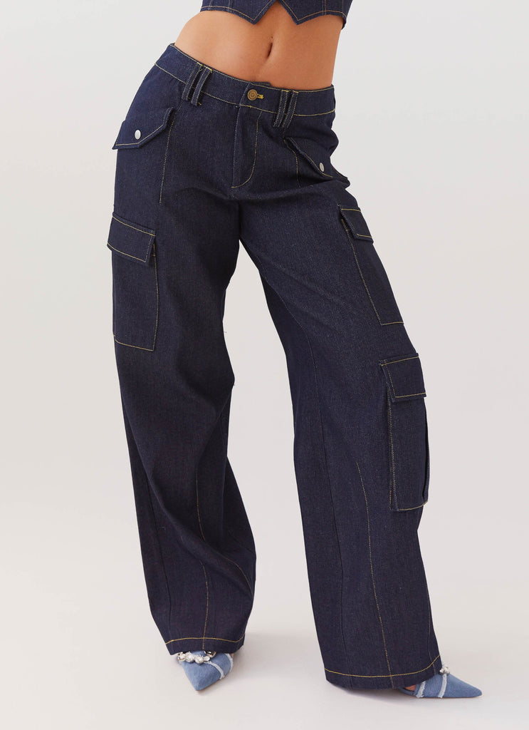 Womens Greedy Denim Cargo Pants in the colour Indigo in front of a light grey background