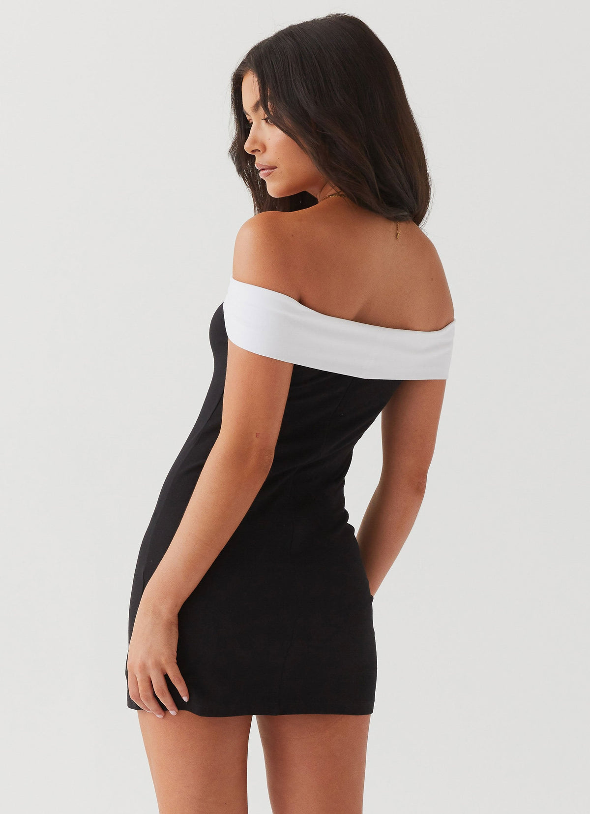 Womens Diamonds and Pearls Mini Dress in the colour Black in front of a light grey background