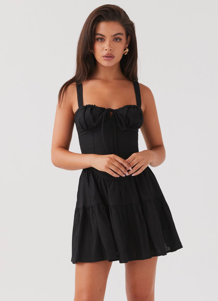 Womens Lucie Linen Mini Dress in the colour Black in front of a light grey background