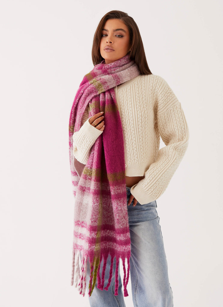 Womens Rainier Plaid Scarf in the colour Pink in front of a light grey background