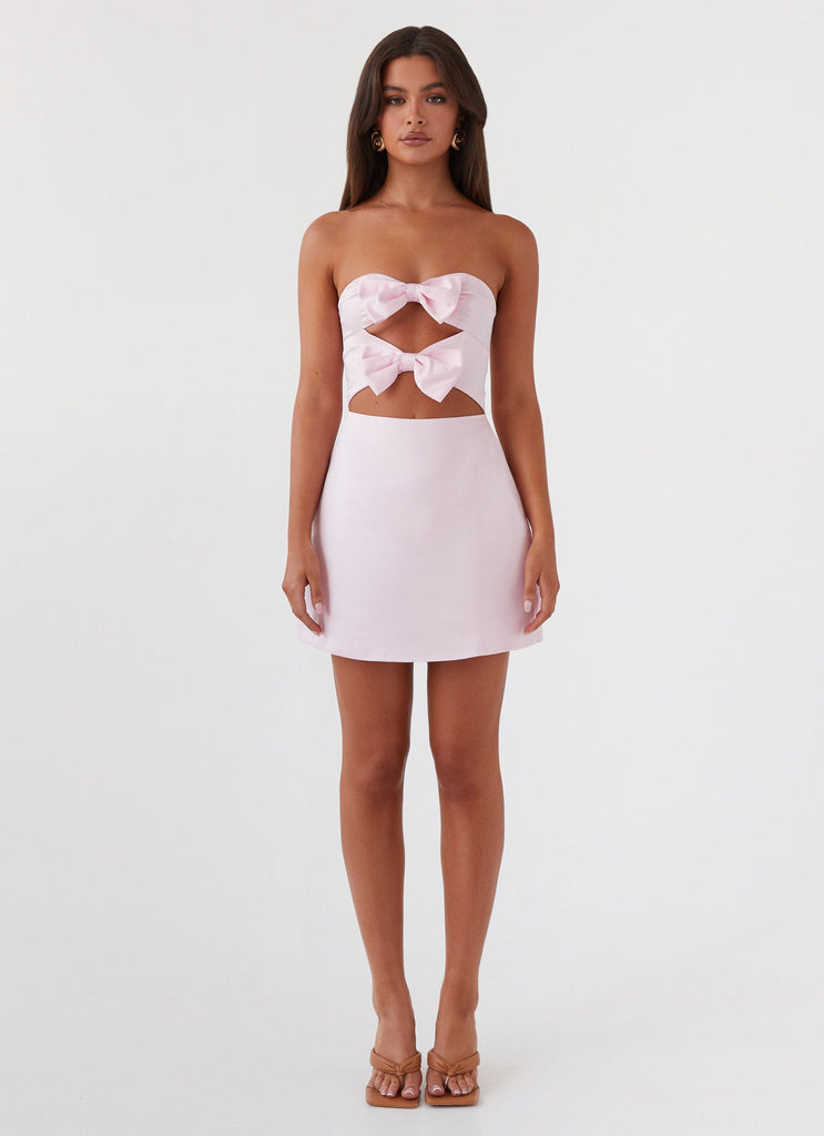 Womens Girl Crush Bow Mini Dress in the colour Pink in front of a light grey background