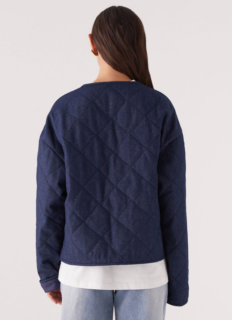 Womens Faded Fall Quilted Jacket in the colour Vintage Blue Wash in front of a light grey background