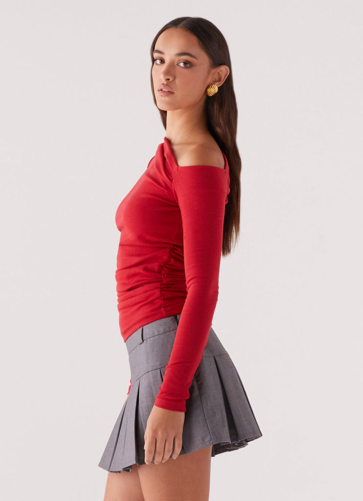 Womens Kiki Long Sleeve Top in the colour Cherry in front of a light grey background