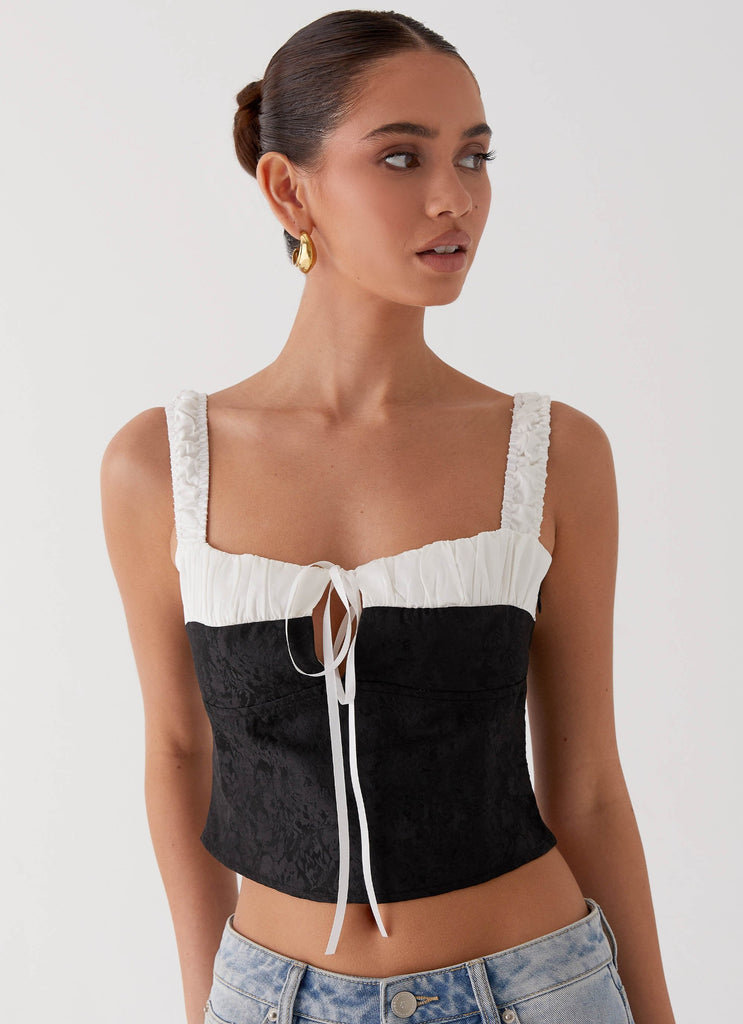 Womens Ryder Bustier Top in the colour Black in front of a light grey background