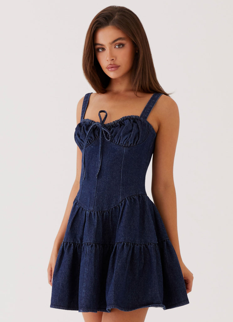 Womens Lucie Denim Mini Dress in the colour Indigo in front of a light grey background