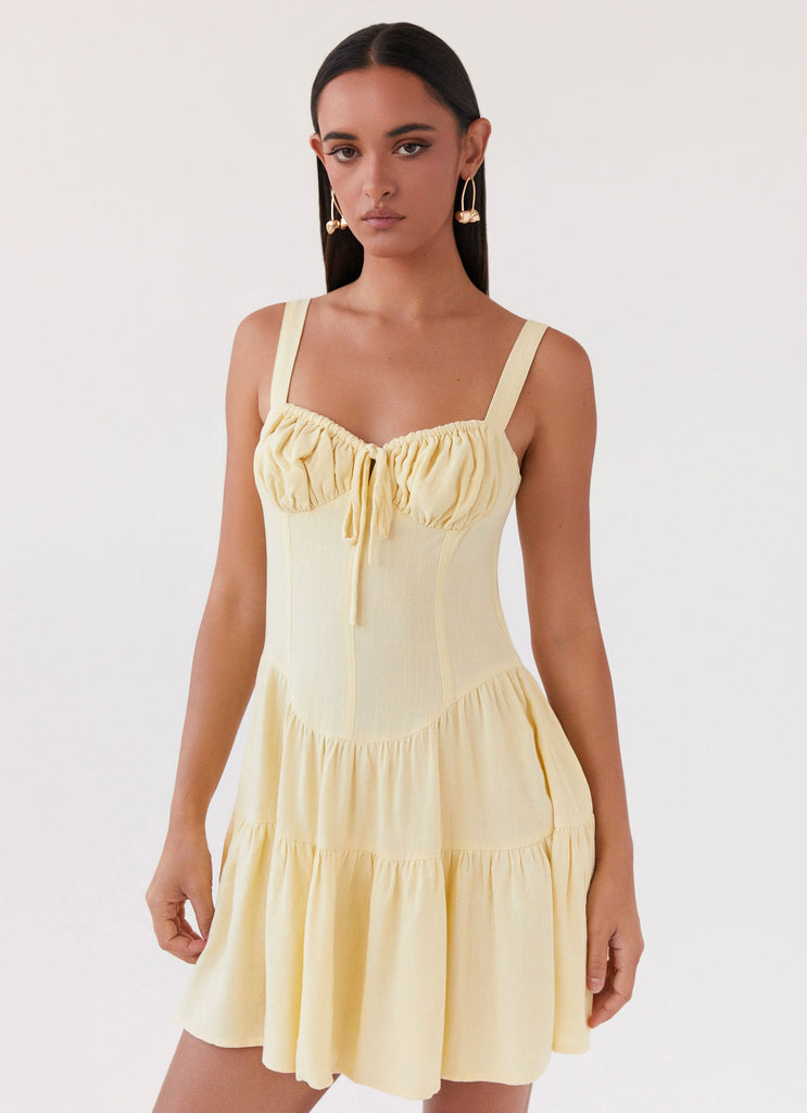 Womens Lucie Linen Mini Dress in the colour Yellow in front of a light grey background