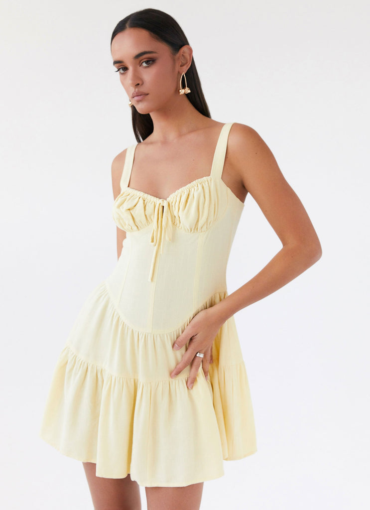 Womens Lucie Linen Mini Dress in the colour Yellow in front of a light grey background