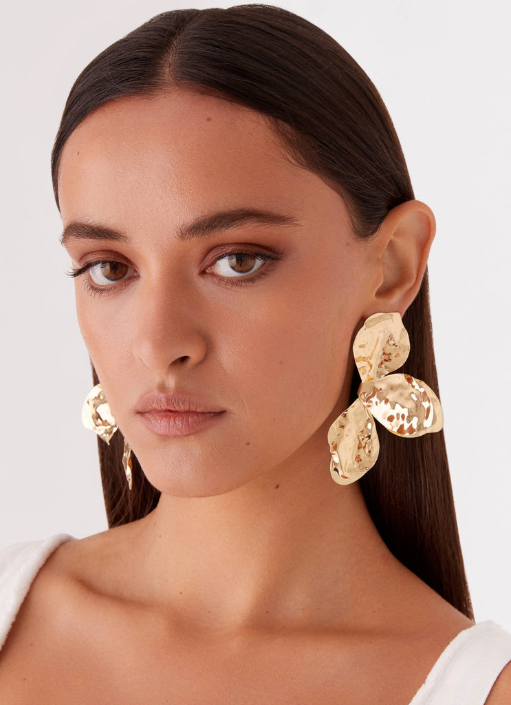 Womens Stonelet Statement Earrings in the colour Gold in front of a light grey background