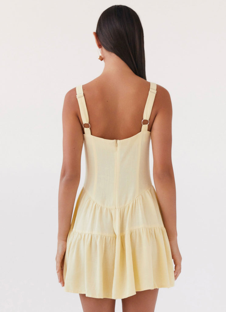 Womens Lucie Linen Mini Dress in the colour Yellow in front of a light grey background